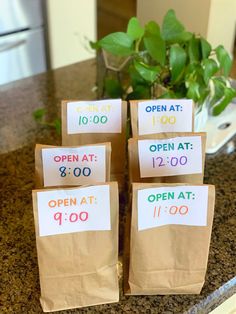 Photo of 6 brown paper bags folded over at the top with a note that says: Open at, and then the hour.  They are bags with goodies to be opened at intervals along the trip. Road Trip Goodie Bags, Road Trip Kit, Kids Travel Activities, Road Trip Food, Activity Bags, Goodie Bags For Kids, Road Trip Activities, Bags For Kids, Family Road Trip