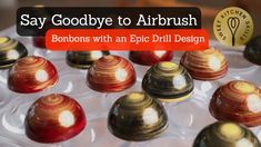 a tray with many different types of marbles on it and the words say goodbye to airbrush