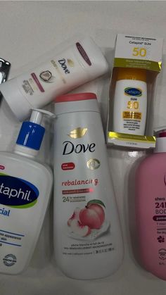 several different types of skin care products on a counter top, including toothpaste and lotion