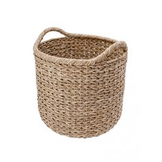 a large round basket with handles is shown in natural colors and has an oval handle