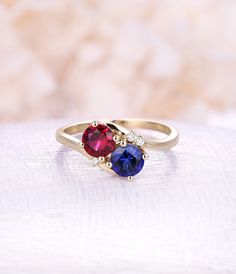 Ruby engagement ring Sapphire engagement ring 14K rose Gold vintage rings woman Wedding Unique Jewelry birthstone Anniversary gift for her All our diamonds are 100% natural and not clarity enhanced or treated in anyway. We only use conflict-free diamonds and gemstones. - Vintage style Ruby and moonstone ring - Natural Conflict free diamonds - comfortable band Lab Ruby Size: 6mm Lab Sapphire Size: 6mm Side sotnes: Natural diamond Weight - approx 0.02CT*3 Clarity - VS-SI Color- H/white Cut - VG - Ruby And Sapphire Engagement Ring, Diamond Birthstone Ring For Proposal, Valentine's Day Promise Diamond Ring With Birthstone, Cubic Zirconia Birthstone Ring For Proposal, Round Cut, Round Cut Birthstone Ring With Accent Stones For Proposal, Round Cut Birthstone Ring For Proposal, Cubic Zirconia Birthstone Ring For Proposal, Round Cut Sapphire Proposal Ring, Proposal Birthstone Ring With Accent Stones