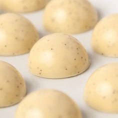 several balls of white chocolate sitting on top of each other