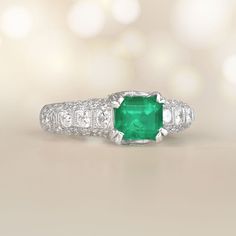 This beautiful 18k white gold emerald diamond accent ring features a 1.22-carat emerald cut emerald set in prongs. Round brilliant-cut diamonds are set on each shoulder. The total diamond weight is 1.48 carats.
The measurements of the center emerald are 5.53mm x 6.66mm x 4.79mm.
This ring can be resized to any finger size at no extra cost.
Ready to Make It Yours? Contact us to reserve this ring and to get more info! Emerald Cut Platinum Jewelry With Pave Setting, Exquisite Emerald Cut Platinum Emerald Ring, Asscher Cut Emerald Ring In Platinum, White Gold Emerald-cut Ring With Pave Setting, Emerald Cut Diamond Ring With Pave Setting, Exquisite Gia Certified Emerald Cut Emerald Ring, Fine Jewelry Emerald Ring In Radiant Cut Platinum, Fine Jewelry Platinum Emerald Ring With Radiant Cut, Radiant Cut Emerald Ring In Platinum