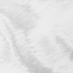 a man riding a snowboard down the side of a snow covered slope on top of skis