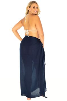 This versatile black plus size Bali sarong can be worn as a swimsuit cover up, sarong skirt or beach dress! Both sporty and elegant, these soft, easy care beach coverups give you comfort and style on hot summer day. Whether lounging on the beach, dining out, or relaxing at home, our lightweight solid sarongs come in colors you’ll love. Choose a different color to fit your mood and bathing suit. Includes a coconut shell clip for easy tying; just put an edge of the fabric in the two holes and pull through for a perfect fit. Length can be adjusted by simply folding the garment down. One size for plus sizes Measures 90.5” x 45”. Made from 100% silky soft, breathable, easy care rayon. Rayon is moisture absorbent (more so than cotton), so this beach skirt will keep you cool and comfortable. Quic Sarong Clip, Sheer Poncho, Black Sarong, Sarong Swimsuit Cover, Tropical Bohemian, Plus Size Swimsuit, Sarong Wrap, Sarong Skirt, Loungewear Dresses