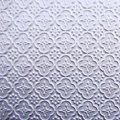 an image of a white textured paper with circles and flowers on the bottom half