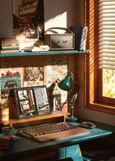 a desk with a computer, lamp and other items on it in front of a window