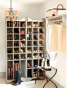 a shoe rack with many pairs of shoes in it