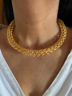 This stunning Hasli necklace is crafted from high-quality brass with a beautiful golden textured finish. Weighing approximately 60 grams, it is a premium-quality piece designed to stand out. Perfect for night outs, its bold design adds a touch of elegance to any outfit, ensuring you'll receive plenty of compliments. Luxury Gold-plated Yellow Gold Choker, Hasli Necklace, Golden Texture, Bold Design, Charm Necklaces, Charm Necklace, Night Out, Jewelry Necklaces, Brass