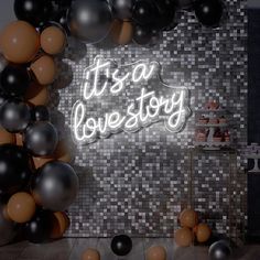 it's a love story neon sign surrounded by balloons and cake on the table