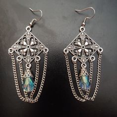 Aqua Glass Crystal Teardrop And Chain Chandelier Earrings. Weight: 0.1 Oz/5 Grams Each. 3.25 Inches/8.3 Cm From The Top Of The Ear Wire. Ear Wires Are Stainless Steel. Brand New, Never Worn Nwt. Handmade By Me, The Sparkliefiend! Metal Teardrop Chandelier Earrings For Party, Teardrop Metal Chandelier Earrings For Party, Party Silver Chain Drop Earrings, Bohemian Metal Teardrop Earrings For Party, Bohemian Teardrop Metal Earrings For Party, Nickel-free Metal Teardrop Earrings For Party, Metal Chandelier Earrings With Chain Dangle, Silver Metal Dangle Chandelier Earrings, Silver Drop Crystal Metal Earrings