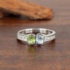 Natural Blue Topaz & Peridot Ring-925 Sterling Silver Ring-Oval Cut Gemstone Ring-Handmade Ring-Peridot & Blue Topaz Ring-Gift for Her-Women's Ring-Gemstone Ring Gift for Wife-Multi Gemstone Ring-Stackable Ring-Multi Stone Staking Ring  ★ PRODUCT DETAILS ★ * SKU:- RG-431-PDBT * Metal:- 925 Sterling Silver * Ring Weight:- 1.65 Gms (Approx.) *  Stone Name:- Peridot & Blue Topaz  *  Stone Shape:- Oval  *  Stone Color:- Green & Blue  *  Stone Cut:- Faceted *  Birthstone:- August & December ★ SHIPPING INFORMATION * We ship item(s) from India to Worldwide in 24 Hours ( 1 working day ) after the payment has been cleared. * We use USPS 1st Class Priority Mail Service for USA which generally delivers the item within 7-10 days. * We also use DHL Global Mail Service (other than USA), which generally Multi Gemstone Ring, Blue Topaz Stone, Peridot Ring, Ring Oval, Topaz Stone, Oval Stone, Multi Stone Ring, Blue Topaz Ring, Multi Stone