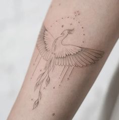 a bird tattoo on the left arm