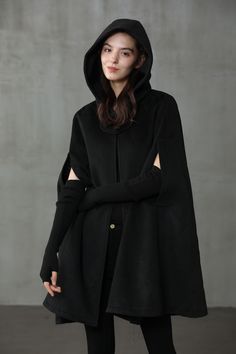 "Seamlessly merging boldness with elegance, Linennaive's approach to even the most casual of pieces ensures that you always look stylish. Spun from a cashmere-virgin wool blend, this black cape is timeless. Featuring a sleeveless design with deep pockets and a flared style. Pull it on and stand out from the crowd. Fabric Outer: Cashmere 95%, Wool 5% Lining: Viscose 100% 1)THE MOST DURABLE We use only the longest fibers, averaging 39-42mm long. That's about 30% longer than regular Grade A cashmer Mantel Cape, Wool Cloak, Coat Cape, Cape Cloak, Hooded Wool Coat, Cashmere Cape, Wool Winter Coat, Black Cape, Black Winter Coat