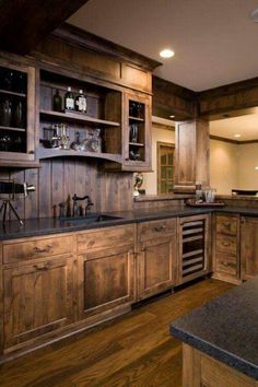 an image of a kitchen setting with wood cabinets and granite counter tops in the center