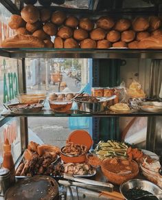 an assortment of food is on display in a store window with other foods and condiments