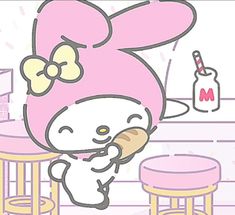 an image of a hello kitty eating bread in the kitchen with milkshake behind her