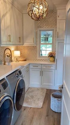 a washer and dryer in a white laundry room