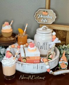 a table topped with cupcakes and drinks