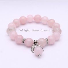 PRODUCT DETAIL :ITEM : ROSE QUARTZ BEADED BRACELETITEM CODE :  DGC2386ITEM NAME :BRACELETGEMSTONE :  ROSE QUARTZBEADS SHAPE : ROUNDLENGTH :   8 INCH /STRETCHABLE BEADS SIZE:  12 MM/ 14MM ApproxWEIGHT :  220 Cts. APPROXCUSTOMIZATION/BULK ORDER : AVAILABLEPLEASE FEEL FREE TO CONTACT IF YOU REQUIRE ANY FURTHER INFORMATION. Silver Rose Quartz Bracelet With 8mm Beads, Rose Gold Rose Quartz Crystal Bracelet With Round Beads, Rose Gold Crystal Bracelet With Round Rose Quartz Beads, Rose Gold Rose Quartz Jewelry With 8mm Beads, Silver Crystal Bracelet With Rose Quartz Round Beads, Silver Rose Quartz Bracelet With Round Beads, Pink Gemstone Beads Charm Bracelet, Rose Quartz Round Beads Bracelet For Valentine's Day, Healing Beaded Bracelets With Round Beads For Valentine's Day