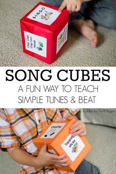 a young boy is holding a box with the words song cubes written on it