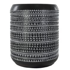 a black and white vase sitting on top of a table