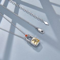 This Lock Necklace is set with the citrine and nanhong that symbolize wealth and good luck. Perfect for everyday wear, enhance your style and attract prosperity with this unique necklace. Material: 925 silver plated with platinum Gemstones: natural citrine, natural nanhong Pendant: 1.5*2cm Chain length: 45+5cm Silver Citrine Necklace In Fine Jewelry Style, Fine Jewelry Silver Citrine Necklace, Yellow Sterling Silver Necklace Fine Jewelry, Silver Citrine Pendant Jewelry, Silver Citrine Necklaces With Birthstone, Silver Citrine Birthstone Necklaces, Silver Citrine Birthstone Necklace, Silver Citrine Necklace With Birthstone, Silver Citrine Gemstone Necklaces