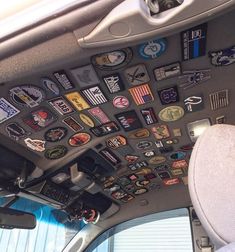 the inside of an airplane with many patches on it