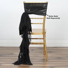 a chair that has been tied up with a black sash on it, and labeled