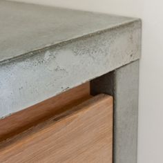 a close up view of a metal and wood dresser