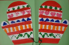 two mitts made out of paper with hearts on them, one is red and the other is green