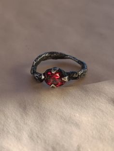 A rough ring, forged deep in the Northern mountains by trolls. Pure troll sterling silver and a blood-red garnet mined in the heart of the mountains. Rough Ring, Blood Red, Red Garnet, Solitaire Ring, In The Heart, Garnet, Sweden, Jewelry Rings, Pure Products