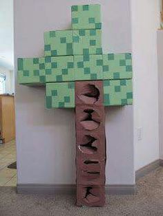 a cross made out of cardboard sitting on the floor next to a wall in an office