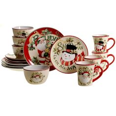 a set of christmas themed dishes and cups