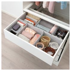 an open drawer with many items in it