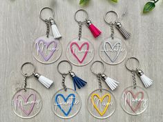 six personalized acrylic key chains with tassels