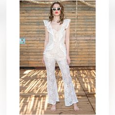 Gorgeous And Sexy Lace Jumpsuit. Nwt Brand Is Seven Wonders From Australia. Available For $120 At Our Store Chiccouturecloset.Com Crafted From Detailed Delicate Lace, Our Flattering Daisy Jumpsuit Will Make Sure All Eyes Are On You. Featuring High Waist With Slight Flared Pants, Frilled Detailing And Delicate Lace. It's The Perfect Jumpsuit For Special Balmy Nights (And Days). - Delicate Luxe Lace - Frilled Detailing Along Shoulder Straps - Boning In The Bodice - Exposed Zip At The Back Of The G White Fitted Jumpsuits And Rompers For Beach, White Fitted Jumpsuit For Beach, White Feminine Jumpsuits And Rompers For Party, Feminine White Jumpsuits And Rompers For Party, Fitted White Jumpsuits And Rompers For Beachwear, Feminine White Jumpsuits And Rompers For Beach, White Fitted Feminine Jumpsuits And Rompers, Feminine White Jumpsuit For The Beach, Feminine White Jumpsuits And Rompers For Summer