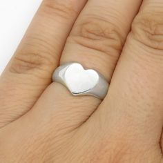 This lovely Heart signet ring is made from sterling (925) silver. It symbolizes love and affection and will make a great Valentine gift or Promise ring. It can also be worn as pinky ring. This ring was carved in jeweler's wax, then cast in sterling silver and hand-polished. Ships in a gift box. This ring is made to size, so please note that production may take up to two weeks. If you need it faster - please contact me before purchase to check availability. You can see my OOAK works on DeviantArt Promise Heart Ring In Sterling Silver With Polished Finish, Sterling Silver Heart Ring With Polished Finish For Promise, Engraved Heart Ring For Promise, Classic Heart-shaped Sterling Silver Engraved Ring, Classic Sterling Silver Heart-shaped Engraved Ring, Engraved Heart Promise Ring, Classic Heart-shaped Engraved Sterling Silver Ring, Classic Sterling Silver Heart Engraved Ring, Heart Shaped White Gold Signet Ring For Promises