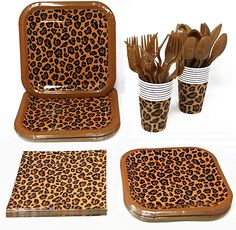 leopard print plates and cups with utensils in them