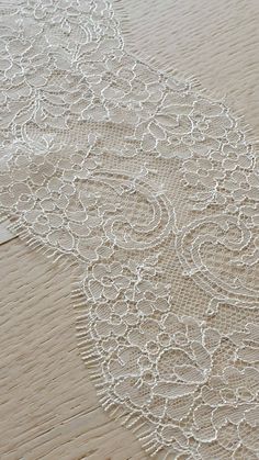 60 cm piece of Ivory lace Trim, Chantilly Lace, French Lace trim, Bridal lace, Wedding Lace, Scalloped lace, Lace Fabric, Fabric by the yard MB00249 Article: MB00249 Colors: Ivory Style: French Width: 12 cm, listed for 60cm (60 cm x 12 cm) Sold per last piece 60cm (60 cm x 12 cm) If you need a different amount, please contact us. Soft and romantic. Perfect for weeding dress,  accessories, veil. Very stunning and elegant! Limited stock. IMPORTANT: Please note, there might be a slight difference i Off White Lace With Lace Trim For Wedding, Elegant White Lace With Contrast Detailing, Ecru Lace With Lace Trim For Wedding, White Lace Trim For Wedding, Elegant Lace Trims For Wedding, Beige Wedding Lace With Lace Trim, Chantilly Lace Trim, Wedding Lace, Chantilly Lace