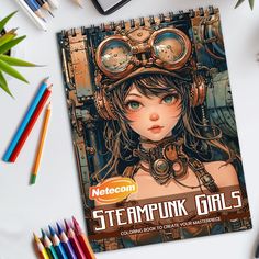 a book with steampunk girls on it next to colored pencils and crayons