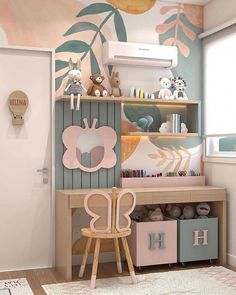 a child's room decorated in pastel colors with flowers and leaves on the wall