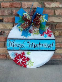 a christmas ornament hanging on the side of a brick wall