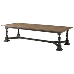 an old style wooden table with black legs