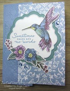 a card with a bird and flowers on it