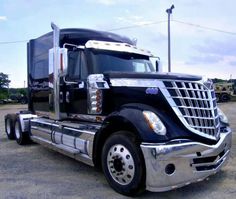 a large semi truck parked in a parking lot