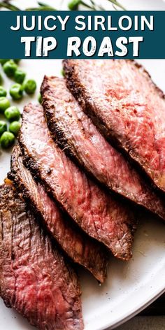 juicy sirloin tip roast on a white plate with green beans