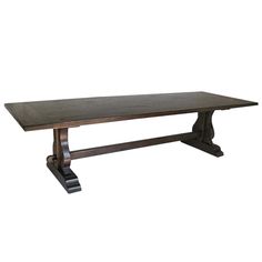 a large wooden table with two legs and a long slab on one end, against a white background