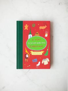 a very scandinavian christmas book on a marble surface