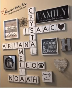 a wall with many different types of family signs on it, including letters that spell out their names